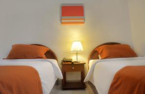 Voodi või voodid majutusasutuse Hotel Castell toas