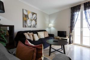 TV a/nebo společenská místnost v ubytování El Atico de los INGLESES by Cadiz4Rentals