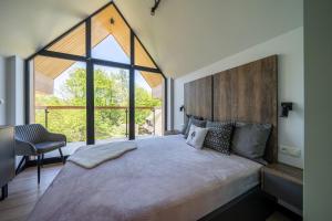 Postel nebo postele na pokoji v ubytování 100m2 z widokiem na Giewont