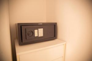 a small tv sitting on a shelf in a wall at Hostal Sunset Ibiza in San Antonio