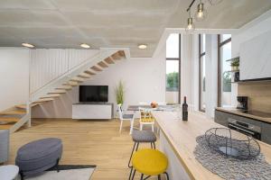 a kitchen and living room with a staircase at Villa Laura Mia by IstriaLux in Juršići