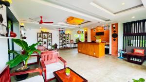 a living room with a couch and a table at Indra Angkor Residence in Siem Reap