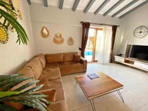 a living room with a couch and a coffee table at Likya Suit B 2+1 Villa, Özel Havuzlu, Fethiye in Fethiye