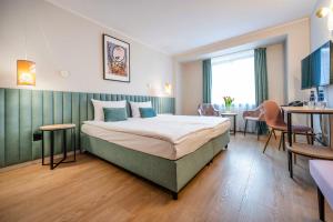 Posteľ alebo postele v izbe v ubytovaní Hotel H12****