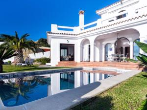 a white house with a swimming pool in front of it at REf 4 CASA BLANCA in Zahara de los Atunes +28 photos
