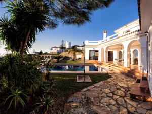 an exterior view of a house with a swimming pool at REf 4 CASA BLANCA in Zahara de los Atunes