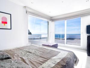 a bedroom with a large bed and a large window at REf 6 VILLA TARA in Zahara de los Atunes +34 photos