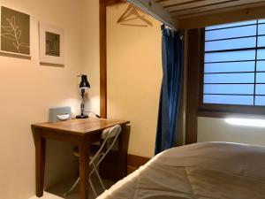 Uma cama ou camas num quarto em DJANGO Hostel & Lounge