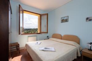 Postel nebo postele na pokoji v ubytování Agriturismo Metina + 37 fotografií