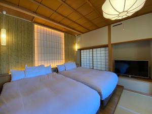 阿施卡里怀石日式旅馆客房内的一张或多张床位