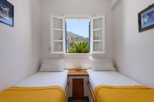 Posteľ alebo postele v izbe v ubytovaní Aigaiou Avra Apartments + 37 fotografií