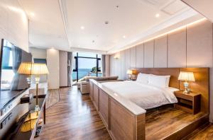 Postel nebo postele na pokoji v ubytování Dyne Oceano Hotel