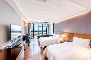 Postel nebo postele na pokoji v ubytování Dyne Oceano Hotel