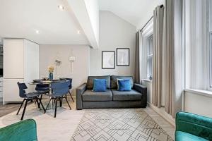 a living room with a couch and a table at Host & Stay - City Centre Duplex Apartment in Liverpool