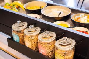 a drawer filled with jars of food in a kitchen at Hotel Kontakt der Kontinenten in Soesterberg