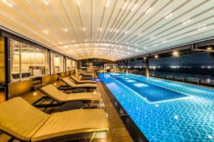 a swimming pool on a cruise ship at night at Dyne Resort in Jeju