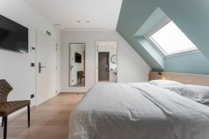 Кровать или кровати в номере Hof Ter Molen - Luxe kamer met privé badkamer