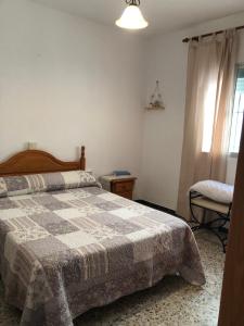 Ένα ή περισσότερα κρεβάτια σε δωμάτιο στο Casa en primera línea de playa
