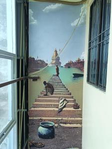 a painting of a stairway leading to the water at Saraswati Palace in Varanasi