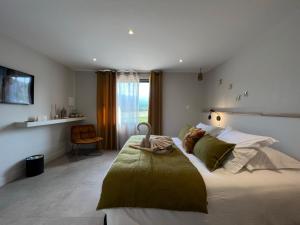 Postel nebo postele na pokoji v ubytování Le Petit Hôtel de Pianottoli-Caldarello