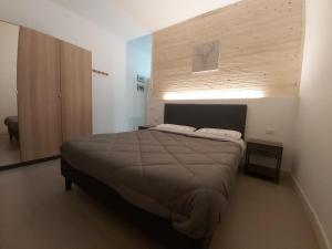 Postel nebo postele na pokoji v ubytování CASALIDIA monolocale