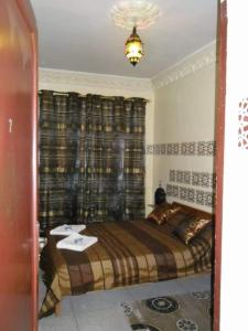 Giường trong phòng chung tại ESCAPADE Assilah