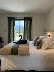 Postel nebo postele na pokoji v ubytování Le Petit Hôtel de Pianottoli-Caldarello
