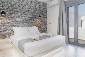 Ένα ή περισσότερα κρεβάτια σε δωμάτιο στο simos luxury apartments