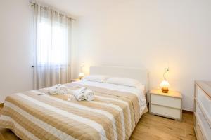 Giường trong phòng chung tại MGH - Malcesine Holiday Apartment