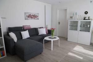 a living room with a couch and a table at Ferienwohnung Hankeln in Winterberg