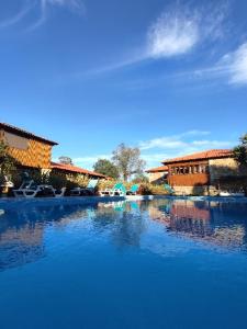 a large body of water with buildings in the background at Luxurious House in Braga with Pool in Barreiros