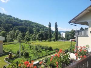 a view of a park from a balcony of a house at Privatni smještaj Radić in Teslić