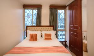 Cama o camas de una habitación en Diamond Plaza Apartments