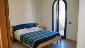 Ένα ή περισσότερα κρεβάτια σε δωμάτιο στο Appartamenti Lungomare Via Roma +71 φωτογραφίες