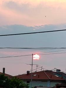 The sunrise or sunset as seen from a vendégházakat or nearby