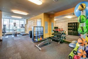 a fitness room with a gym with tread machines at Bellevue 2BR w BBQ Gym WD walkable area SEA-315 in Redmond