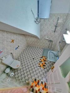 a bathroom with a toilet and a sink at Beach front apartment Psili Ammos in Psili Ammos