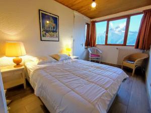 Postelja oz. postelje v sobi nastanitve Appartement 8 personnes vue exceptionnelle