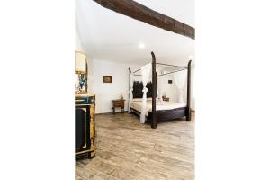 a bedroom with a bed and a mirror at Margot Family in Venaria Reale