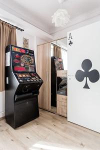 a room with a pinball machine in a room at Brand new, large apartment with opening discount in Budapest