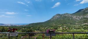 a view from a balcony with mountains in the background at DIKA Apartment in Bar