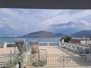 a balcony with a view of a body of water at Ηome Rent Chalkida in Kánithos