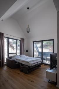 Säng eller sängar i ett rum på KEEP Business Suite H66-2 nahe Audi & Schwarz Gruppe mit Balkon, Netflix & Parkplatz
