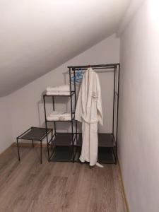a room with a shelf with a robe on it at Lake House Gyumri 
