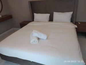 Uma cama ou camas num quarto em Salalah Beach Villas