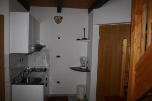 a small kitchen with a sink and a stove at Apartment Pokrajac in Rovinjsko Selo +25 photos