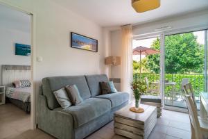 Posezení v ubytování Le Kichen - Appt proche de la plage + 4 fotografie