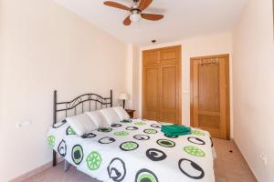 Łóżko lub łóżka w pokoju w obiekcie Vacaciones Sol y Playa