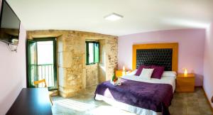 A bed or beds in a room at CASA BELAI