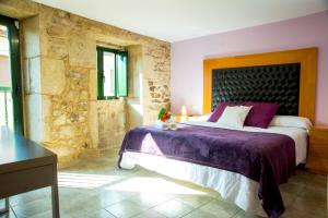A bed or beds in a room at CASA BELAI Még 36 kép